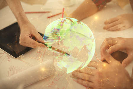 Double exposure of social network theme drawing and man and woman working together holding and using...