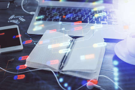 Multi exposure of data theme drawings and desk with open notebook background. Concept of education