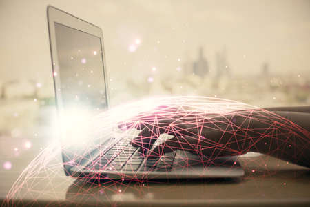 Double exposure of woman hands typing on computer and social network theme hologram drawing. People...