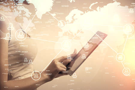 Double exposure of social network sketch hologram and woman holding and using a mobile device.