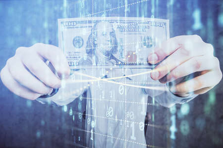 Double exposure of technology drawing hologram and us dollars bills and man hands. Data conceptの写真素材