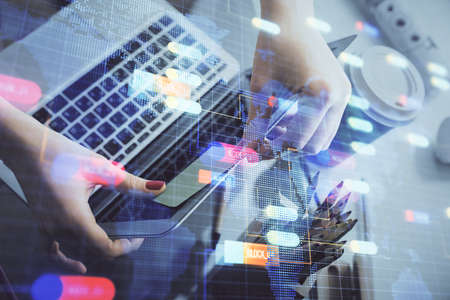 Multi exposure of woman hands working on computer and data theme hologram drawing. Tech concept.