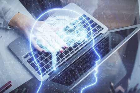 Multi exposure of woman hands working on computer and human brain hologram drawing. Ai tech concept.の写真素材