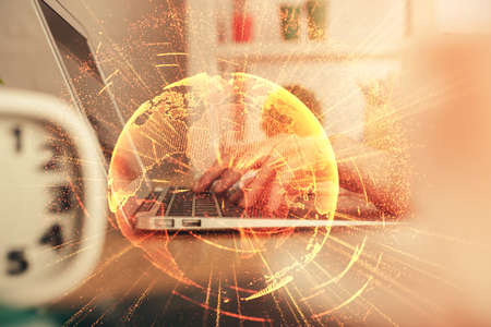 Double exposure of woman hands typing on computer and social network theme hologram drawing. People...