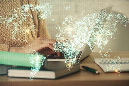 Double exposure of woman hands typing on computer and social network theme hologram drawing. People media concept.の写真素材