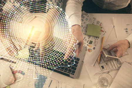 Double exposure of man and woman working together and human brain hologram drawing. Brainstorm concept. Computer background. Top View.の写真素材
