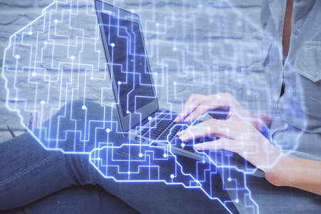 Multi exposure of woman hands working on computer and brain hologram drawing. Ai concept.