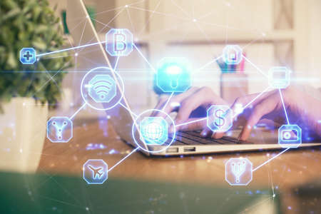 Double exposure of woman hands typing on computer and social network theme hologram drawing. People media concept.の写真素材