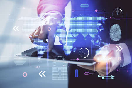 Multi exposure of man's hands holding and using a digital device and map drawing. International...