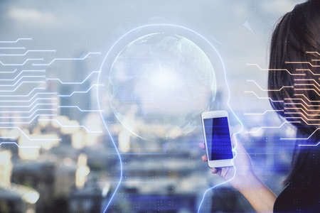 Double exposure of brain sketch hologram and woman holding and using a mobile device.の写真素材