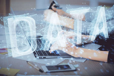 Multi exposure of woman hands working on computer and data theme hologram drawing. Tech concept.