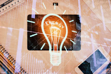 Double exposure of bulb drawing over table with phone. Top view. Concept of idea.