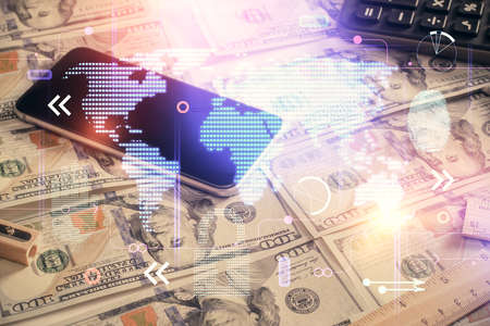 Double exposure of world map drawing over us dollars bill background. International concept.の写真素材