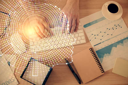 Double exposure of man's hands typing over computer keyboard and brain hologram drawing. Top view. Ai and data technology concept.の写真素材