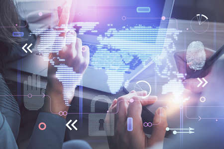 Double exposure of man and woman working together and technology theme world map drawing hologram....