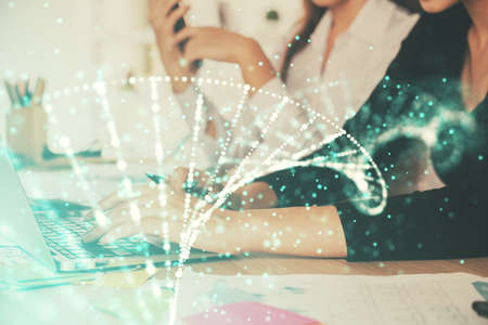 Double exposure of woman hands typing on computer and DNA hologram drawing. Medical education concept.の写真素材