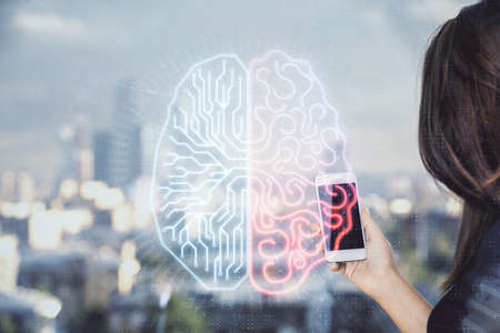 Double exposure of brain sketch hologram and woman holding and using a mobile device.の写真素材