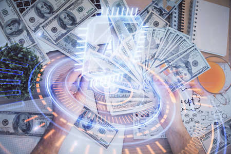 Multi exposure of technology drawing hologram and us dollars bills and man hands. Data concept