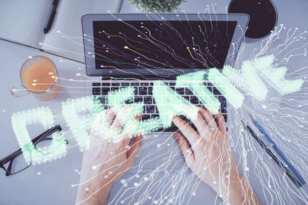 Double exposure of man's hands typing over computer keyboard and conceptual start up theme drawing....