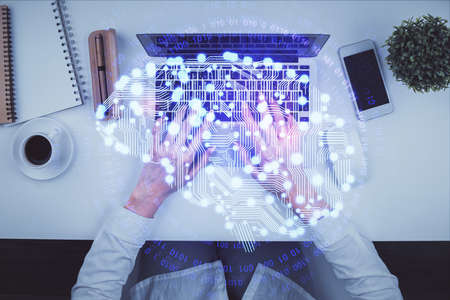 Double exposure of woman working on computer andhuman brain hologram drawing. Top View. Ai concept.