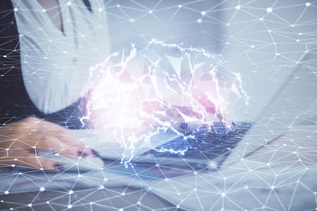 Multi exposure of woman hands working on computer and human brain hologram drawing. Ai tech concept.