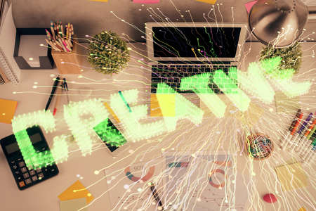 Start up theme drawing over computer on the desktop background. Top view. Double exposure....