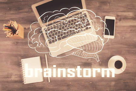 Start up theme drawing over computer on the desktop background. Top view. Double exposure. Brainstorm concept.の写真素材