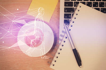 Start up theme drawing over computer on the desktop background. Top view. Double exposure....