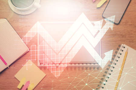Double exposure of drawing arrows over table with phone. Top view. Growth concept.