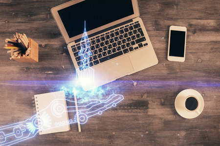 Start up theme drawing over computer on the desktop background. Top view. Double exposure. Brainstorm concept.の写真素材