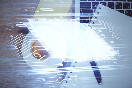 Double exposure of data drawing hologram over topview of study desk background with computer....