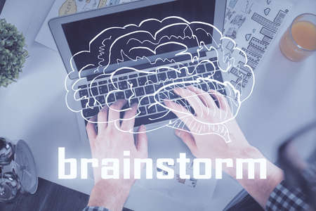 Double exposure of man's hands typing over computer keyboard and conceptual start up theme drawing. Top view.の写真素材