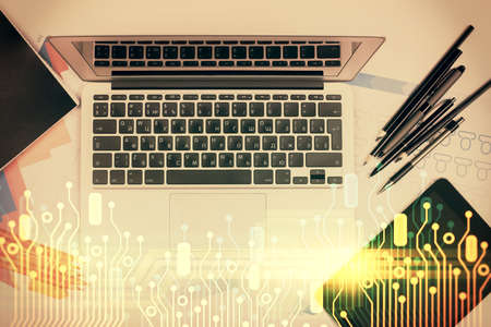 Multi exposure of data drawing hologram over topview of study desk background with computer. Concept of technology.の写真素材