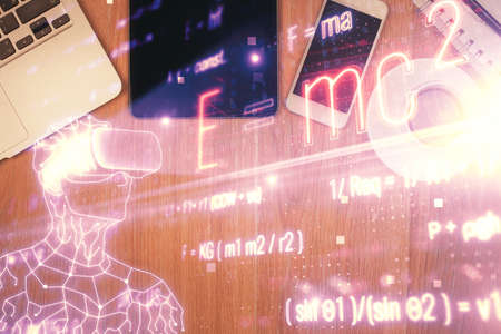 Double exposure of formula drawing over table with phone. Top view. Education concept.の写真素材