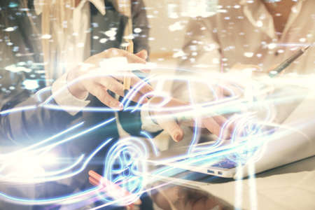 Double exposure of man and woman working together and a car hologram drawing. Autopilot concept....