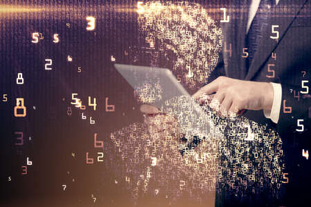 Double exposure of man's hands holding and using a digital device and tech theme hologram drawing....
