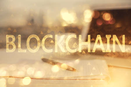 Double exposure of blockchain theme drawings and desk with open notebook background. Concept of Crypto currencyの写真素材