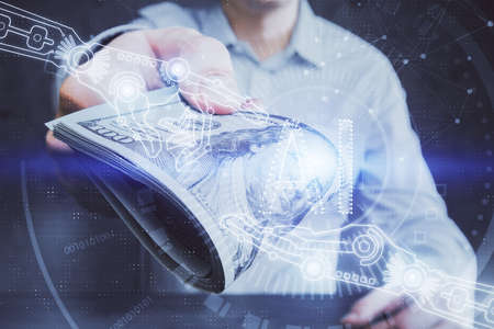 Double exposure of technology drawing hologram and us dollars bills and man hands. Data conceptの写真素材