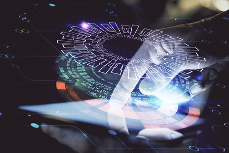 Double exposure of man's hand holding and using a digital device and data theme hologram drawing. Technology concept.の写真素材