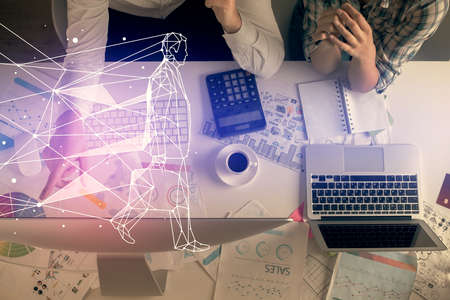 Double exposure of man and woman working together and creative hologram drawing. Computer...