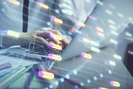 Multi exposure of woman hands working on computer and data theme hologram drawing. Tech concept.の写真素材