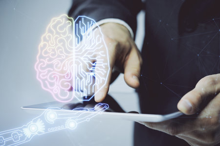 Double exposure of man's hand holding and using a digital device and brain hologram drawing. Data concept.の写真素材