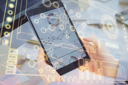 Multi exposure of man's hands holding and using a digital device and data theme drawing. Innovation concept.の写真素材