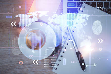 Double exposure of map hologram drawing over study table background with computer. Concept of...