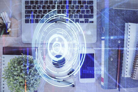 Double exposure of technology theme drawing over work table desktop. Top view. Global data analysis...