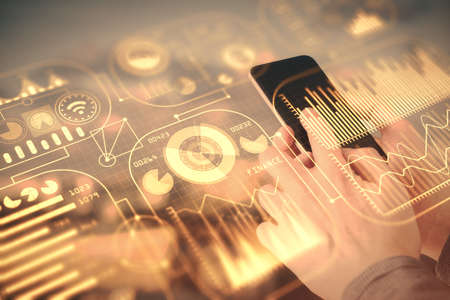 Double exposure of man's hands holding and using a digital device and tech theme hologram drawing. Technology concept.の写真素材