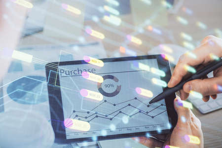 Multi exposure of man's hands holding and using a digital device and data theme drawing. Innovation...
