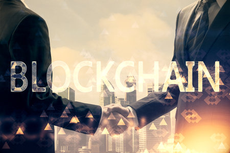 Double exposure of blockchain hologram and handshake of two men. Crypto business concept.の写真素材