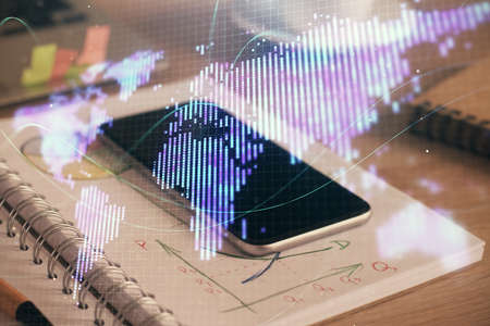 Double exposure of financial graph drawing and cell phone background. Concept of forex trading