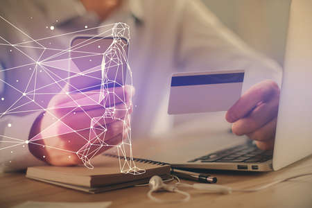 Double exposure of man hands holding a credit card and creative drawing. Start up and E-commerce pay...